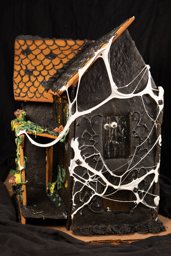 haunted gingerbread house with spiderwebs