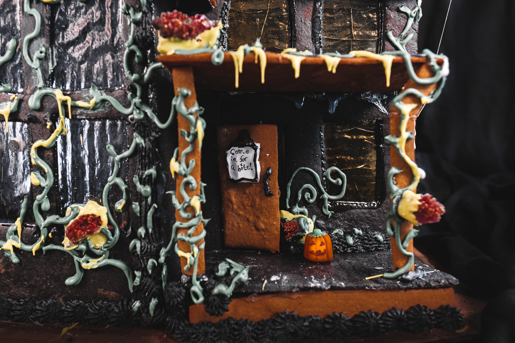 haunted gingerbread house with pumpkin